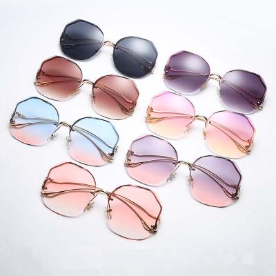 China Eyewear Shopping New Mocoo Rimless Cut Sunglasses Shape Crystal Gradient Lens Rimless Bent Leg Sunglasses 2020 for sale