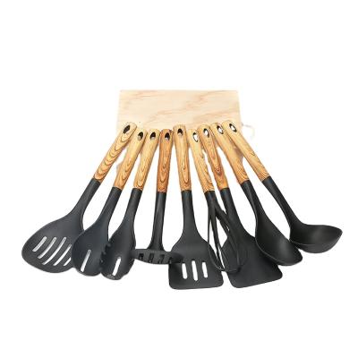 Κίνα 9 Pieces Multifunctional Non-Stick Safe Nylon Material Tool Kit Sustainable Kitchen Shovel With Wooden Pattern Handle προς πώληση