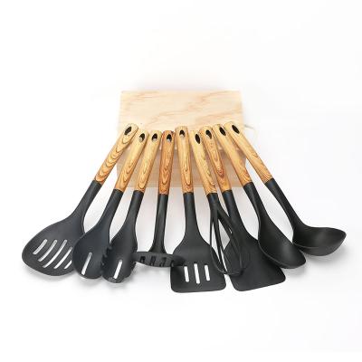 China Sustainable 9 Piece Cookware Set Nylon Kitchen Cooking Utensil Set With Wood Style Handle Te koop