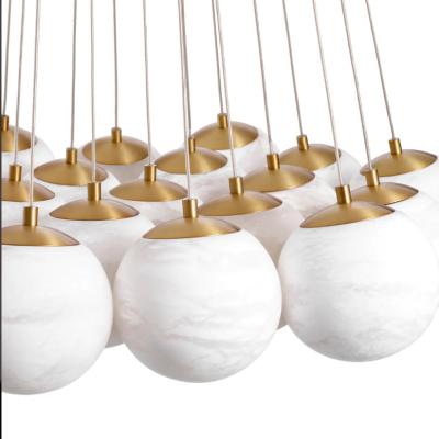 China Modern Art Decorative Pendant Lights High Ceiling Round Hotel Chandelier for sale