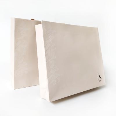 China Disposable Deboss Handling Square Special Paper Custom Paper Bag With Own Logo for sale