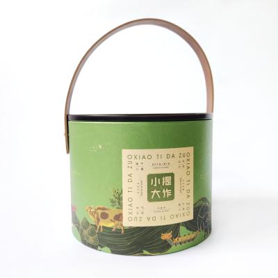 China Recycled Materials Coated Newspaper Delivery Tour Paper Handle Leather Rivet Custom Tea Product Box for sale