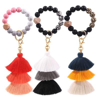 China Wholesale Eco-friendly Silicone Beaded Bracelet Key Chain With Wooden Tassel Bead Bracelet Key Ring for sale