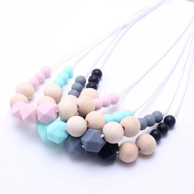 China 100% Hot Sale Food Grade Silicone Beads Baby Teething Necklace Non-Toxic BPA Free Wooden Chew Sensory Necklaces For Boys Girls for sale