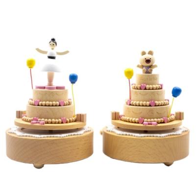 China Creative Rotating Music Box Wooden Ornaments Wooden Gift Music Box Birthday Cake Music Box for sale