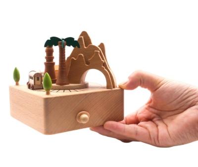 China Wsmall handmade creative gift coconut tree country train will move music box for sale