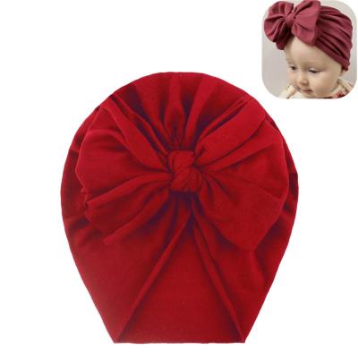 China 2021 hot sale baby dobby unisex headwear headbands cute bow hat for children's cap sleeve cap turban hats for sale