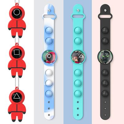 China Creative New Cartoon Squid Finger Press Push Button Wristband Push Bubble Silicone Wristband Toy For Kids for sale