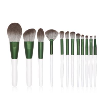 China Angular Blush New Product Custom Logo Eye Brushes 12 Pcs Green Gloss Makeup Brushes for sale