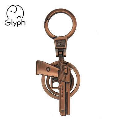 China Wholesale 3d eco-friendly bronze fancy gun shaped key chain craft handmade keychain for promotional gift for sale