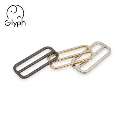 China Eco-friendly Wholesale Clothing Metal Hardware Slider Adjuster Metal Buckles Tie Buckles For Bags And Garment for sale