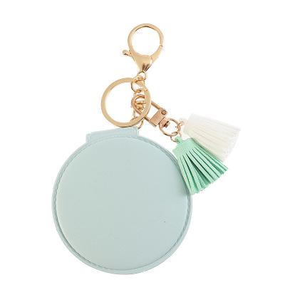 China Double Sided Personalized Small Hand Pocket Mini Puff Fur Ball Compact Mirror Pom Poms Key Chain for sale