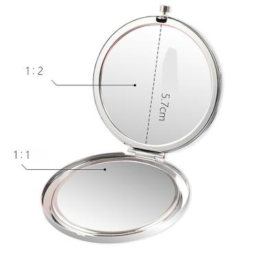 China Mini Double Sided Portable Folding Travel Mirror 2x Magnification Beauty Makeup Mirror for sale