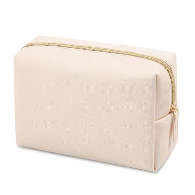 China Wholesale custom beige travel fashion logo cosmetic bag large capacity for women cosmetics storage bag for sale