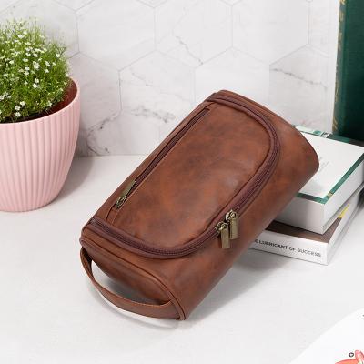 China Fashion Unisex Men Travel Toiletry Bag Organizer Storage Bag PU Leather Toiletries Bag With With Hanging Hook for sale