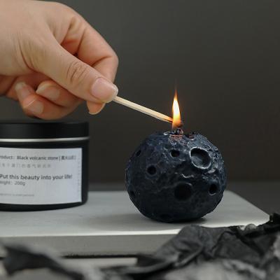 China Custom Made Soy Wax Birthdays Matte Black Moon Shaped Aromatherapy Oil Relaxing Scented Candle for sale