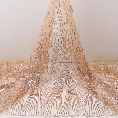 China 2020 latest high quality Heat-insulation sequin lace embroidery fabric for dresses wholesales for sale