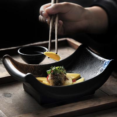 China Viable Wholesale Restaurant Used Irregular Shape Matte Black Appetizer Plate Creative Ceramic Serving Dish for sale