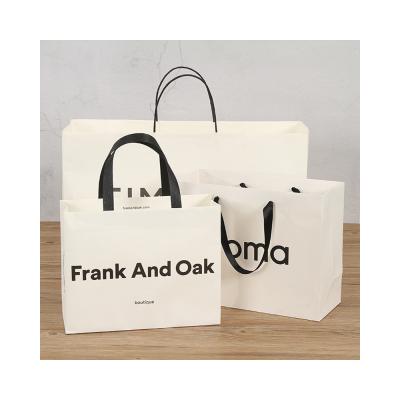 China Clothes 2021 High Quality Customizable Brown Durable Paper Bags For Pack Clothes for sale