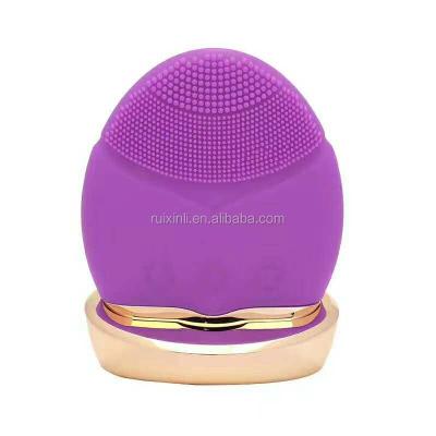 China RUIXINLI Silicone Rechargeable Ultrasonic Facial Sweep Device Electric Facial Rechargeable Silicone Cleansiing Skin Facial Massager With Base for sale