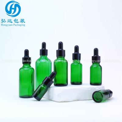 China Factory Wholesale Green High Grade Serum Glass Bottle 10ml 15ml 20ml 30ml 50ml 100ml Serum Bottles For Personal Skin Care for sale