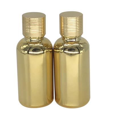 China Glass packaging materials for cosmetics factory direct sale 30ml gold plated essential oil bottle, auto plated bottle, cosmetics plated essential oils for sale