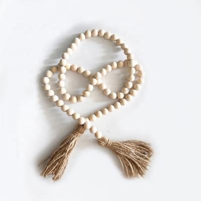 China Art Deco Wood Bead Garland with Tassels Farmhouse Beads New Arrival Objects Horizontal Decorative Cotton Tie Hanging Different Colors for sale