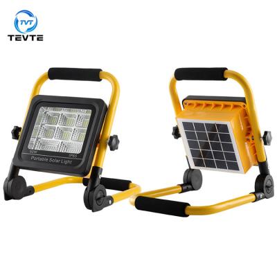 China Garden high ip65 bright outdoor 50w waterproof led solar flood light for garden lawn villa portable work light for sale