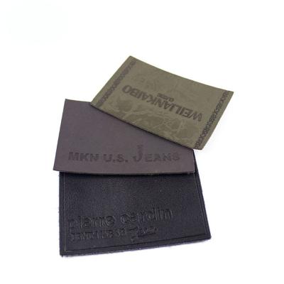 China High quality cheap heat transfer custom logo heat price PU leather labels viable for jeans clothing for sale