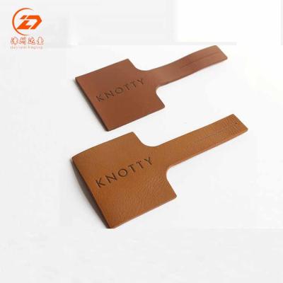 China Viable China Supplier Customized Embossed Faux PU Leather Labels For Clothing Wholesale Custom Jeans Leather Label for sale