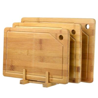 China Large Sustainable Chopper Bamboo Cutting Board With Juice Groove And Hook Hole for sale