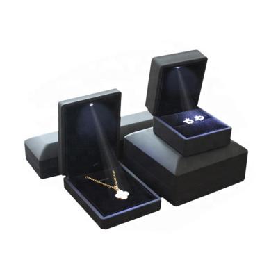 China Handmade wholesale premium custom logo plastic ring boxes jewelry design with led light for sale