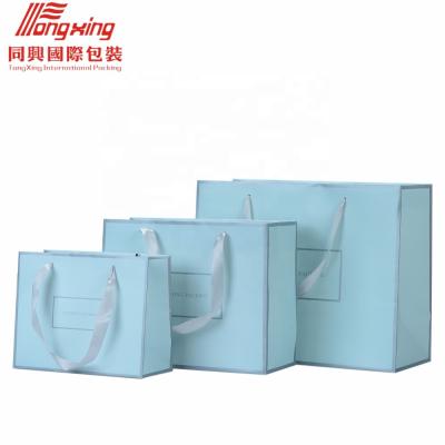 China Morden customized cheap wholesale professional paper bag shopping bag with your own logo for sale