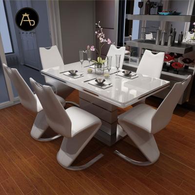 China Newest hot-selling extendable dining room set of wooden dining table with dining chairs for sale