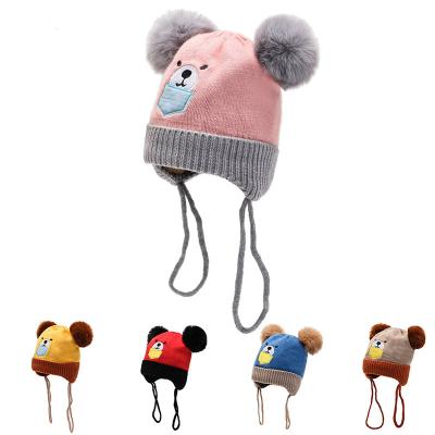 China Cute wool and wool plush ball cartoon baby knitted hat Korean version double ball children's hat hearing protection wool warm hat for sale