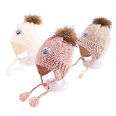 China New wool and wool plush ball autumn and winter thickened simple knitted warm children's ear protection hat wool hat for sale