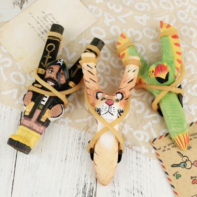 China 2021 Reusable New Design Creative Handmade Painted Wooden Crafts Of Variety Wood Carving Animal Slingshot for sale