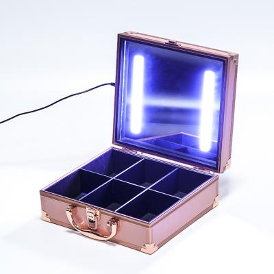 China Hot Selling Fashoion Rose Gold Train Shell Makeup Hard Case With Lights for sale