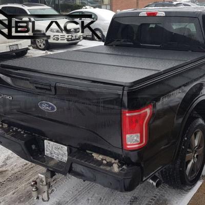 China Tailbox Custom-Fit Pickup Truck Tonneau Covers For Ford F150 Aluminum Antioxidation Canopy Triple Truck Bed Protector for sale