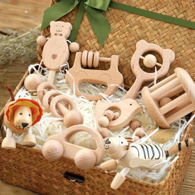 China 100% Eco-Friendly/Wholesale Handmade Non-toxi Montessori Ratchets Beech Wooden Teether Set Baby Teethers for sale