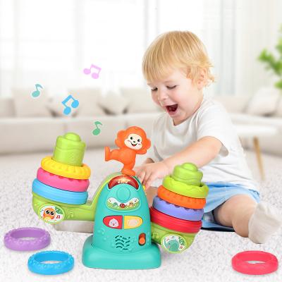 China Light/Music/Colorful Rainbow Seesaw Stacker Toys Kids Stacker With 10PCS Rainbow Ring Baby Toys For Children for sale