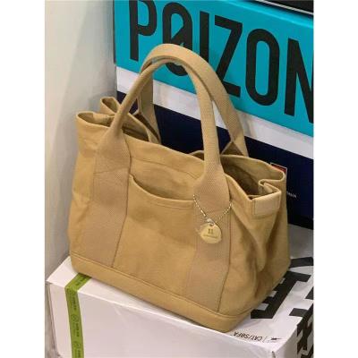 China 2024 NEW HIGH-END SENSE OF NICHE DESIGN CANVAS TOTE BAG WOMEN'S BAG FASHION ALL VINTAGE SINGLE SHOULDER CROSSBODY BAG for sale