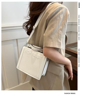 China SIMPLE FASHION LETTER BAG WOMEN'S NEW INS COMMUTER HANDBAG SMALL SQUARE BAG SENIOR TEXTURE WIDE SHOULDER STRAP CROSSBODY for sale