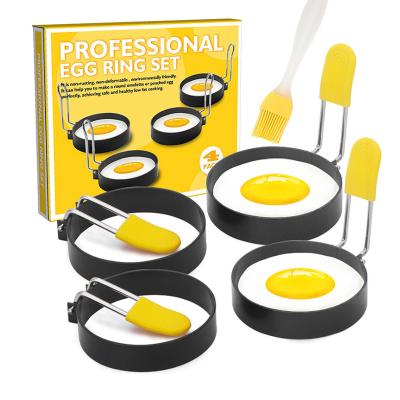 China 4 Pack Egg Stiring Non-Stick Round Egg Cooker Ring Mold with Silicone Anti-scald Handle and Oil Brush for sale