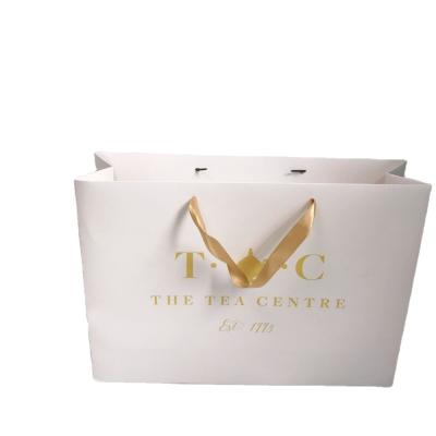 China Recyclable Customizable Famous Brand Printed Candy Cheap Fashion Paper Bag Creative Printing With Handles Paper Bags High Quality Paper Bag for sale