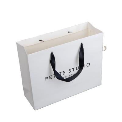 China Manufacturer Of Recyclable Custom Printed White Paper Bag With Black Handles for sale