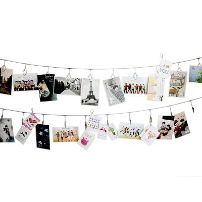 China As Photo Hanging Clips Creative Modern Metal Long Picture Clips For Photo Wall for sale