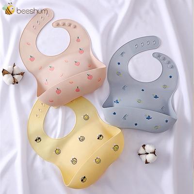 China PVC Free Wholesale Adjustable Baby Feeding Bib Food Grade Silicone Baby Bibs for sale