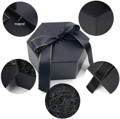 China Attractive Custom Gift Packaging Foldable Magnetic Gift Box With Ribbon Closure for sale