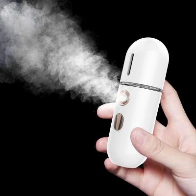 China Nourishing Water Replenishing Instrument Beauty Face Steamer Facial Massager Handheld Usb Charge Handy Nano Mist Sprayer for sale